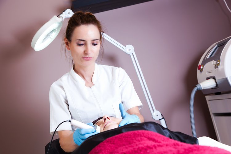 esthetician with client