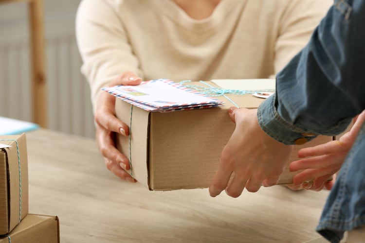 post office worker giving parcel